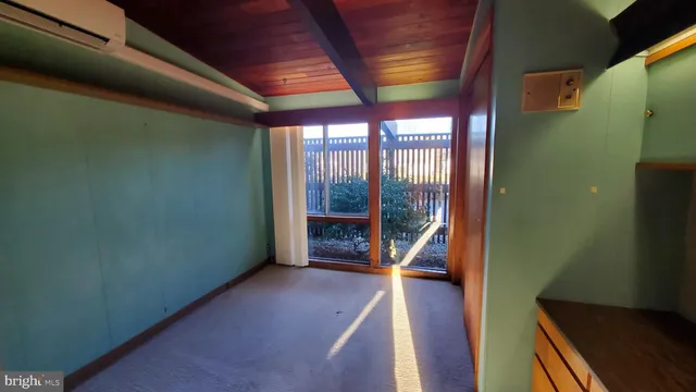 a view of room with furniture and windows