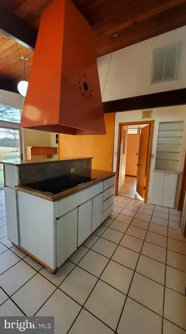 a view of a gallery with wooden floor