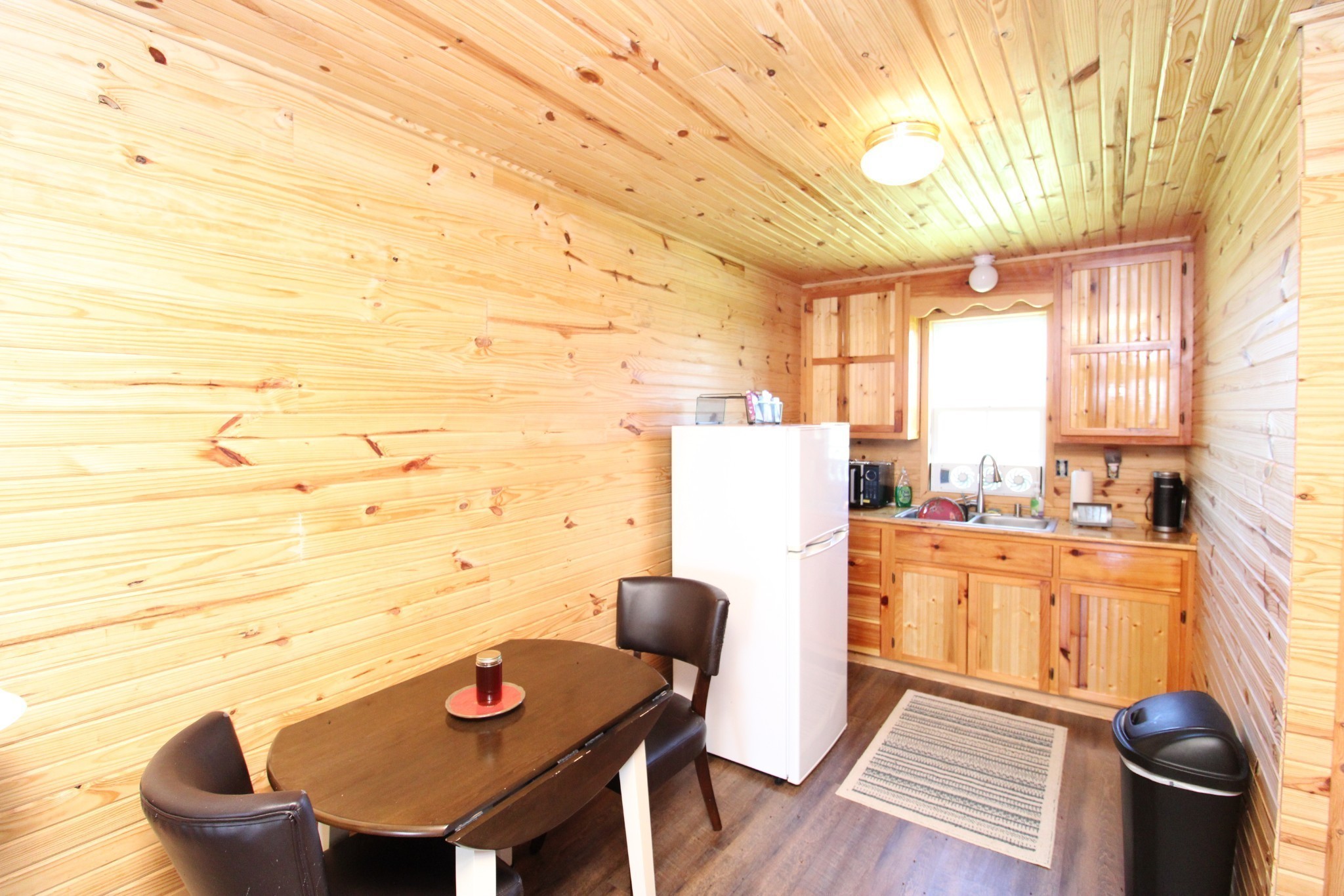 2271 East Stinson Road Lafayette, TN 37083 - Photo 11 of 50 a view of a dining room with furniture and wooden floor