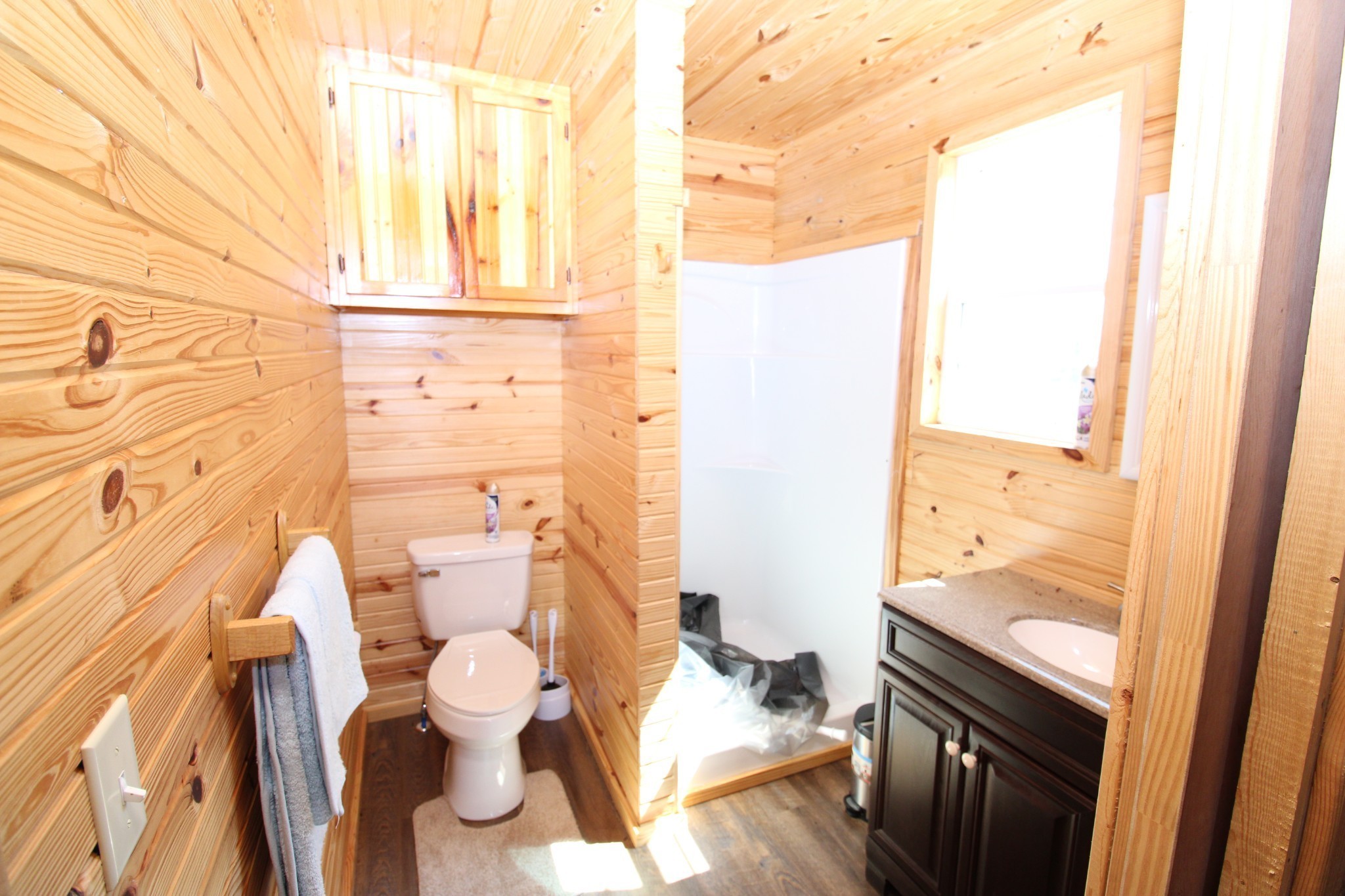 2271 East Stinson Road Lafayette, TN 37083 - Photo 15 of 50 a bathroom with a toilet sink and a shower