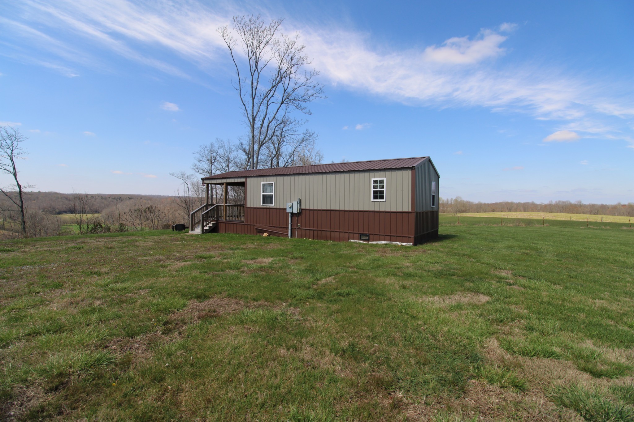 2271 East Stinson Road Lafayette, TN 37083 - Photo 5 of 50 a backyard of a house with lots of green space