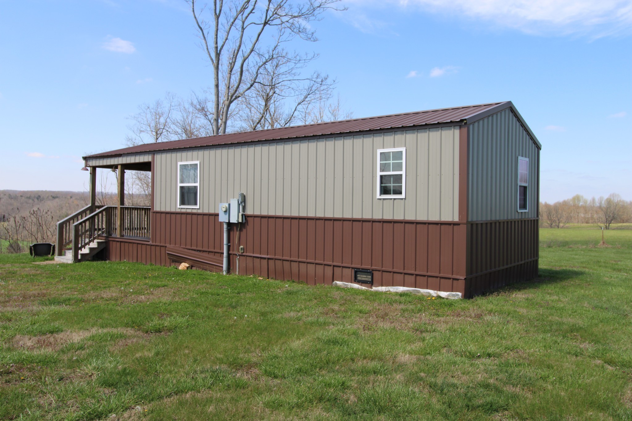 2271 East Stinson Road Lafayette, TN 37083 - Photo 6 of 50 a view of a house with a yard and deck