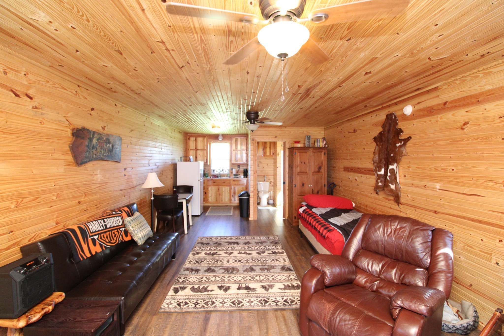 2271 East Stinson Road Lafayette, TN 37083 - Photo 8 of 50 a living room with furniture a rug and a chandelier