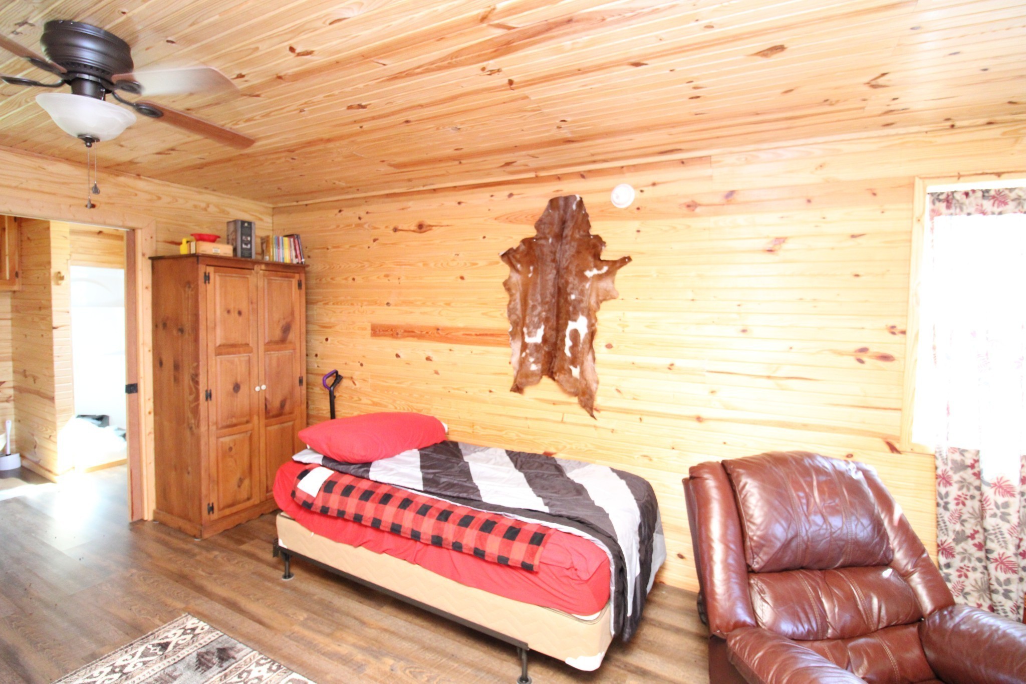 2271 East Stinson Road Lafayette, TN 37083 - Photo 9 of 50 a bedroom with a bed and a couch