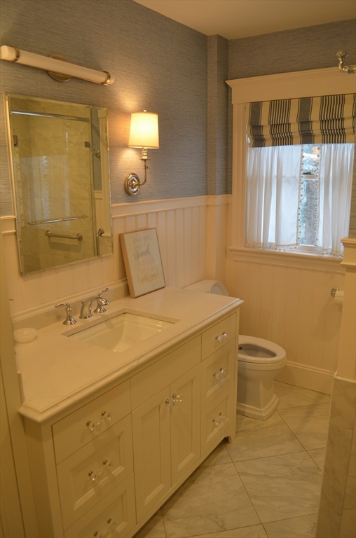 10 Berwick Road Lexington, MA 02420 - Photo 12 of 19 a bathroom with a sink a toilet and shower