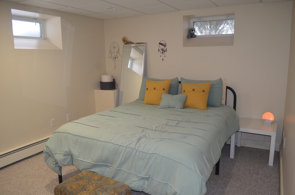 10 Berwick Road Lexington, MA 02420 - Photo 16 of 19 a bedroom with a bed and a window