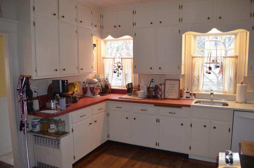 10 Berwick Road Lexington, MA 02420 - Photo 5 of 19 a kitchen with stainless steel appliances a sink stove and cabinets