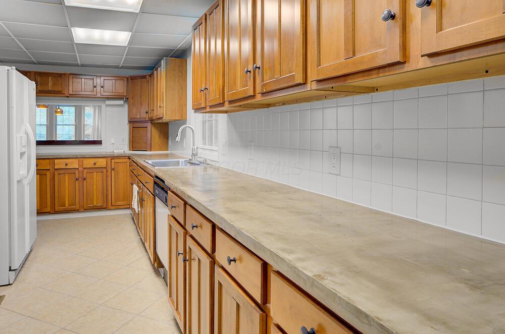 668 Enfield Road Columbus, OH 43209 - Photo 6 of 46 Plenty of prep space on the concrete counters for large dinner parties.