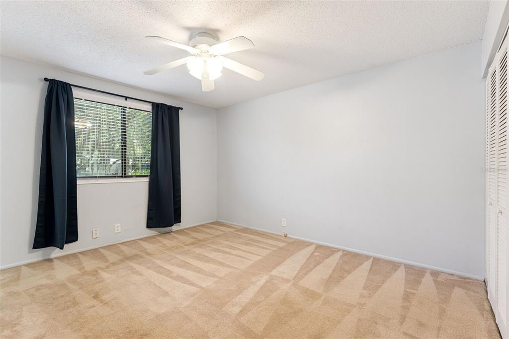 40 Moree Loop, Unit 7 Winter Springs, FL 32708 - Photo 15 of 31 a view of a big room with windows and chandelier fan