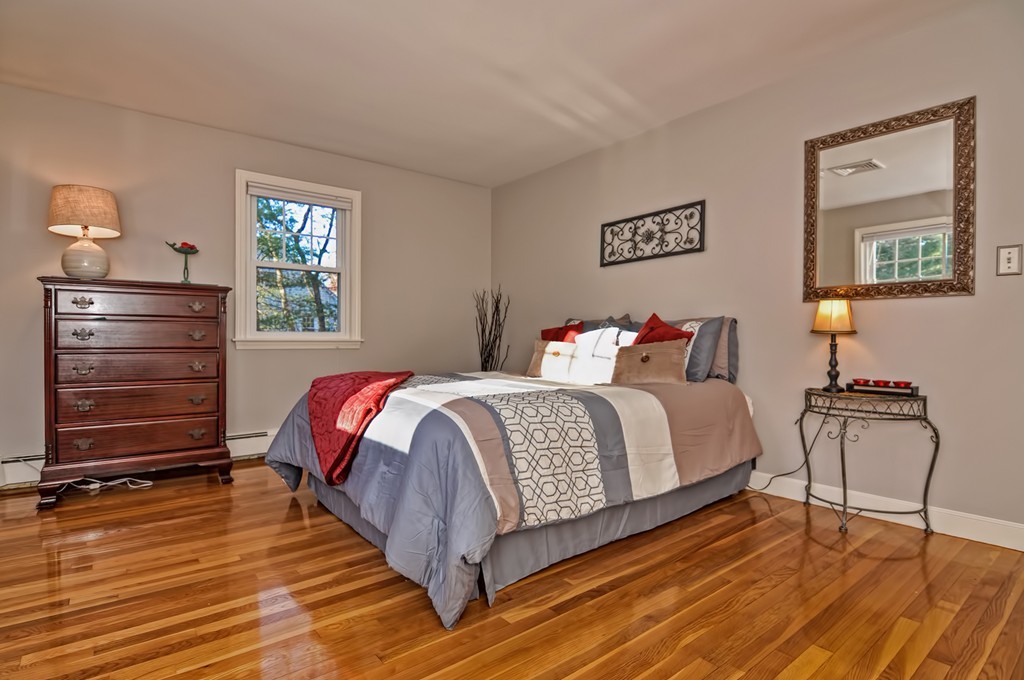 13 Phyllis Road Foxboro, MA 02035 - Photo 12 of 30 a bedroom with a bed and wooden floor