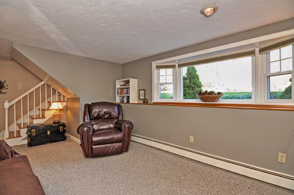 13 Phyllis Road Foxboro, MA 02035 - Photo 21 of 30 a living room with furniture and a large window