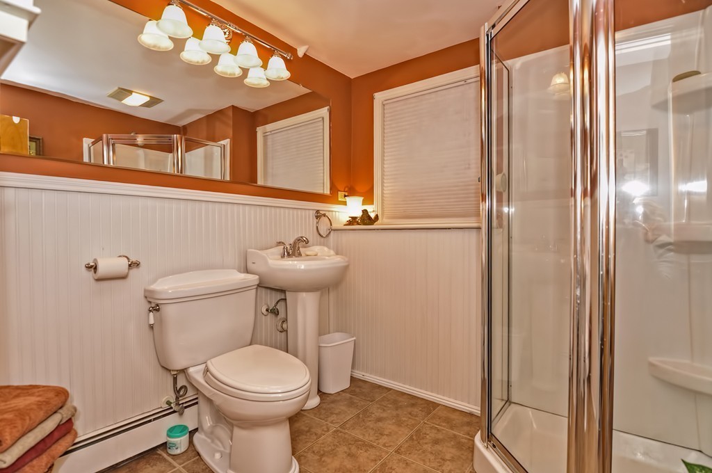 13 Phyllis Road Foxboro, MA 02035 - Photo 23 of 30 a bathroom with a toilet a sink and a mirror