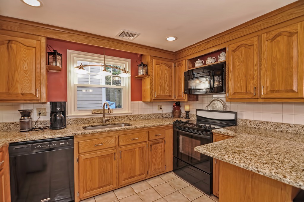 13 Phyllis Road Foxboro, MA 02035 - Photo 5 of 30 a kitchen with stainless steel appliances granite countertop a stove sink and cabinets