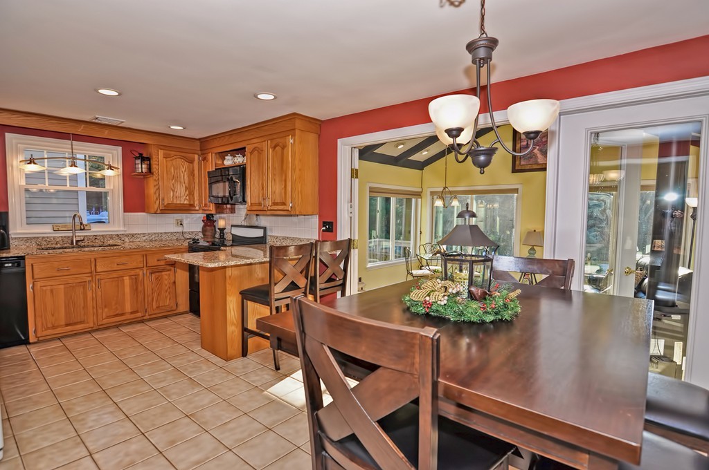 13 Phyllis Road Foxboro, MA 02035 - Photo 6 of 30 a view of a dining room with furniture wooden floor and chandelier