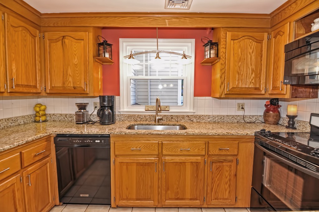 13 Phyllis Road Foxboro, MA 02035 - Photo 7 of 30 a kitchen with stainless steel appliances granite countertop a sink stove and cabinets