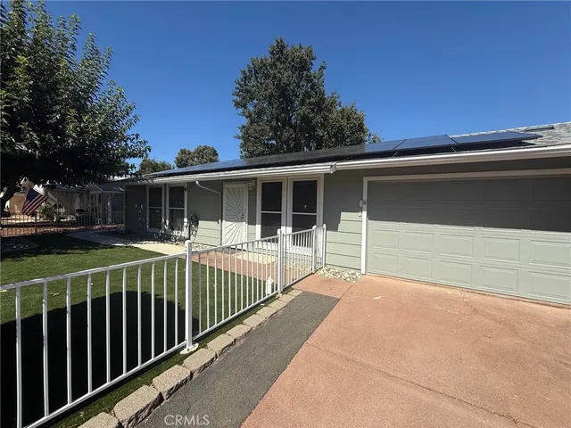a house view with a garden space