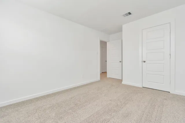 a view of a house with backyard and garden