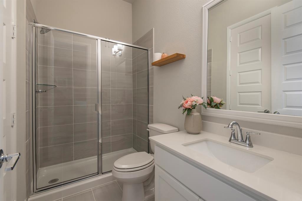 16650 Nightshade Road Frisco, TX 75033 - Photo 25 of 40 a bathroom with a sink toilet and shower