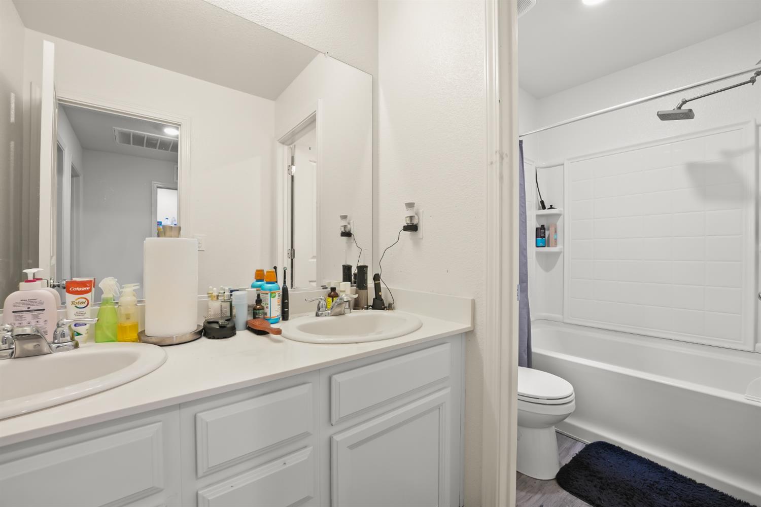 11789 Socrates Way Rancho Cordova, CA 95742 - Photo 12 of 23 a bathroom with a sink a toilet and shower