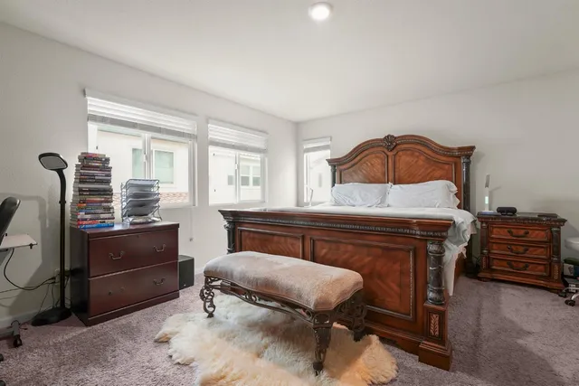 a bedroom with a bed and furniture