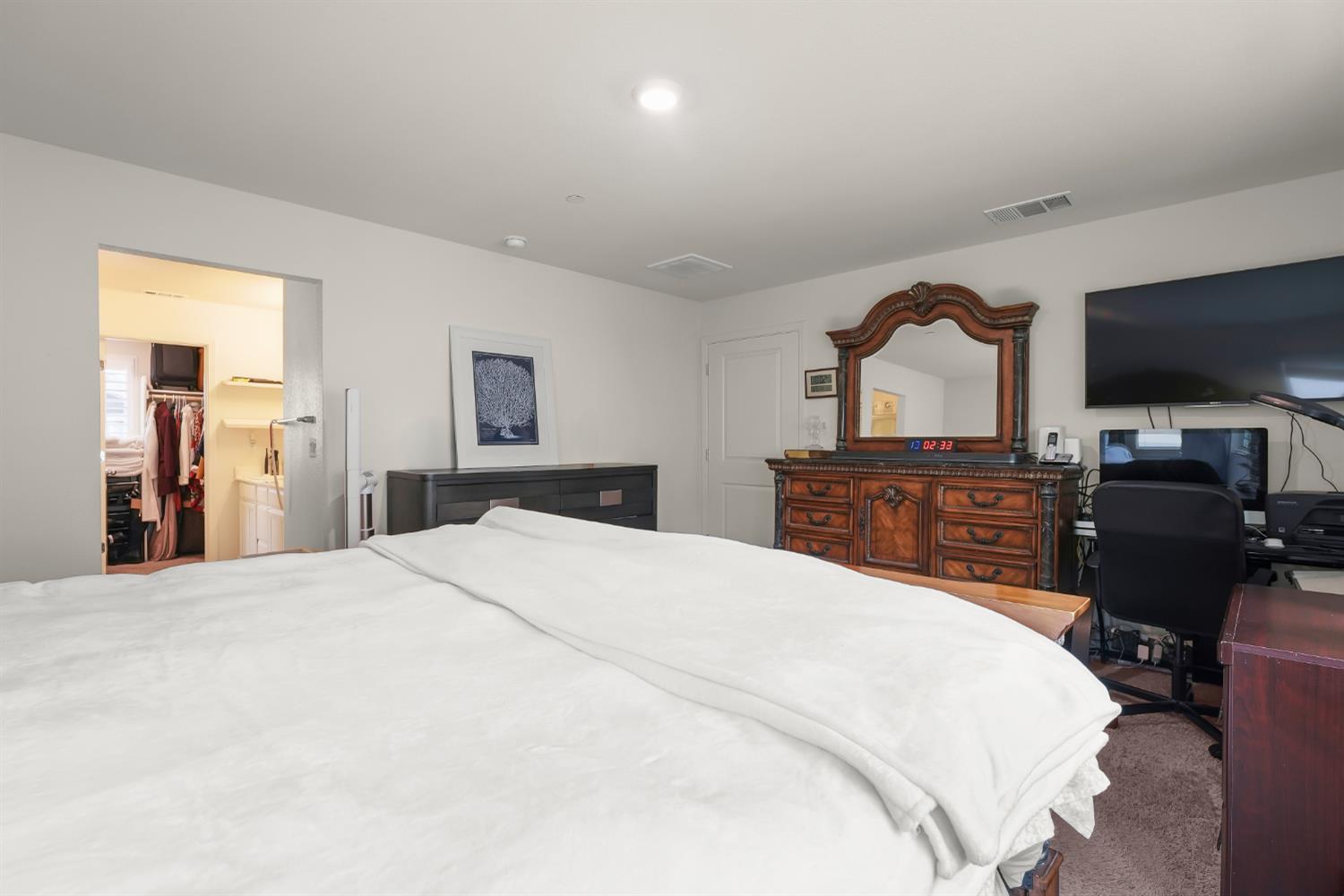 11789 Socrates Way Rancho Cordova, CA 95742 - Photo 14 of 23 a bedroom with a bed and a television