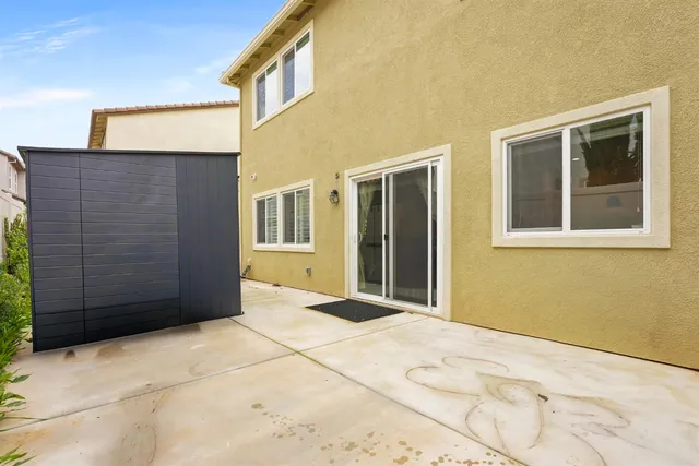 a view of a brick house with an outdoor space