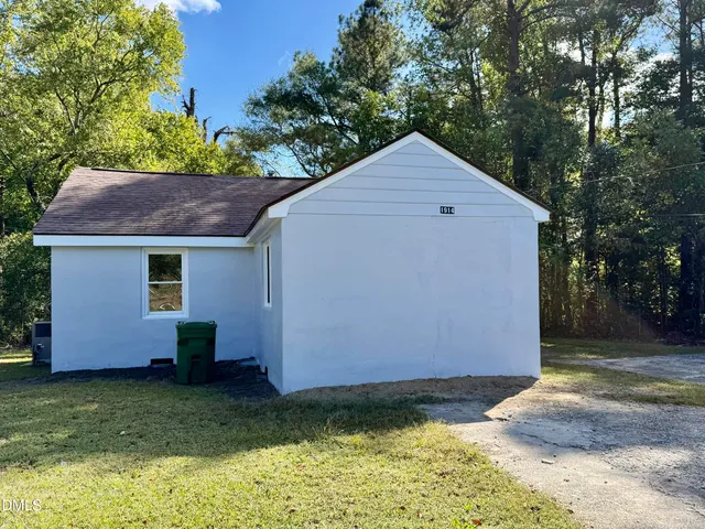 a backyard of a house with lots of green space