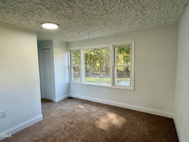 an empty room that has a window