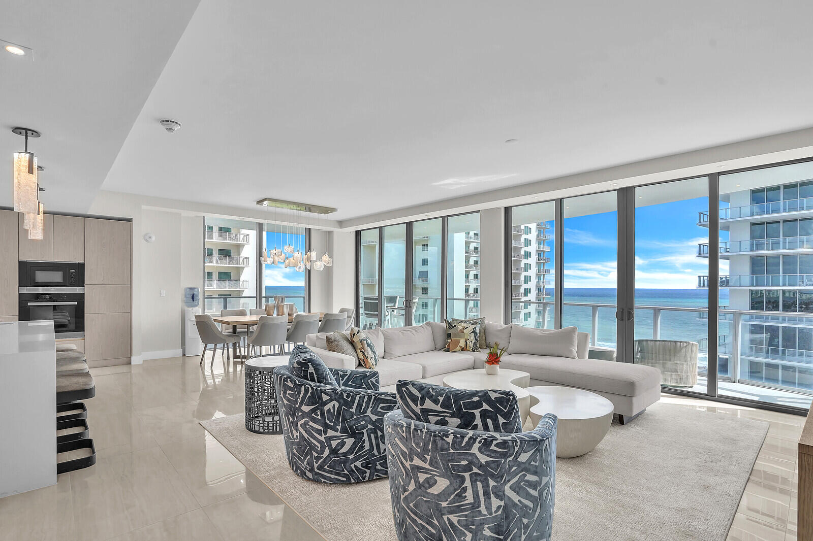 3100 North Ocean Drive, Unit 1202P Singer Island, FL 33404 - Photo 1 of 17 a living room with furniture a large window and a table