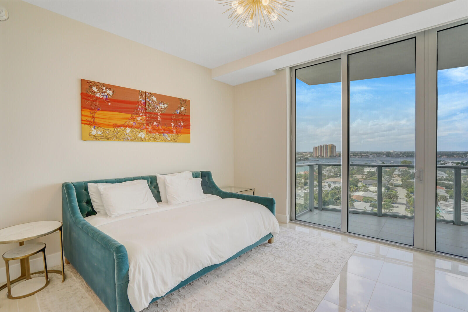 3100 North Ocean Drive, Unit 1202P Singer Island, FL 33404 - Photo 12 of 17 a bedroom with a large bed and a balcony view