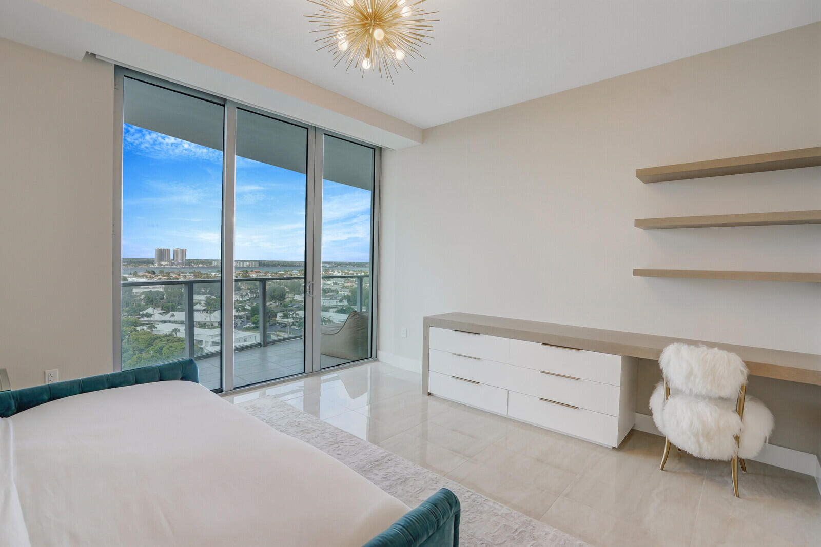 3100 North Ocean Drive, Unit 1202P Singer Island, FL 33404 - Photo 13 of 17 a bedroom with a large bed and a large window