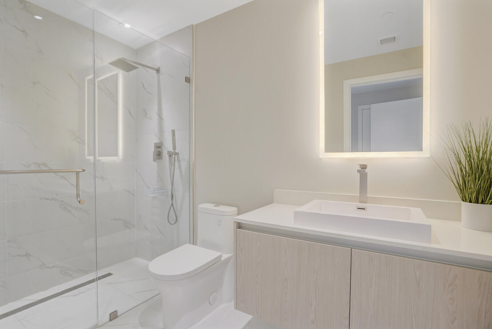 3100 North Ocean Drive, Unit 1202P Singer Island, FL 33404 - Photo 14 of 17 a bathroom with a sink toilet and shower