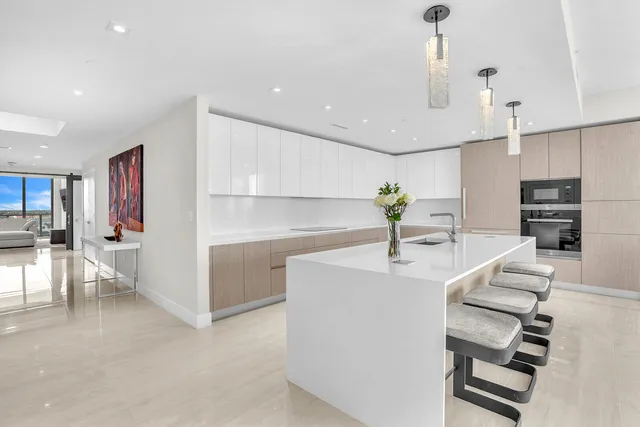 a kitchen with furniture and a chandelier