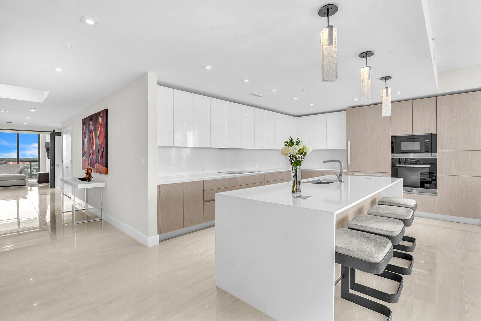 3100 North Ocean Drive, Unit 1202P Singer Island, FL 33404 - Photo 4 of 17 a kitchen with furniture and a chandelier