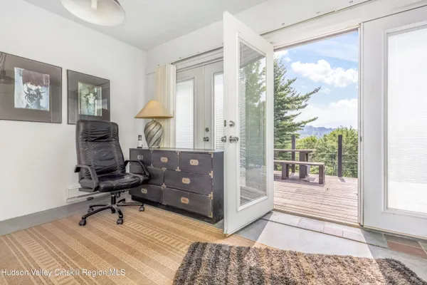 a workspace with hardwood area and windows