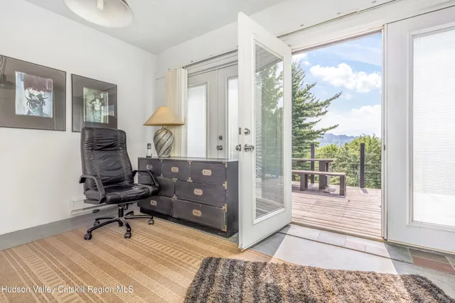 a workspace with hardwood area and windows