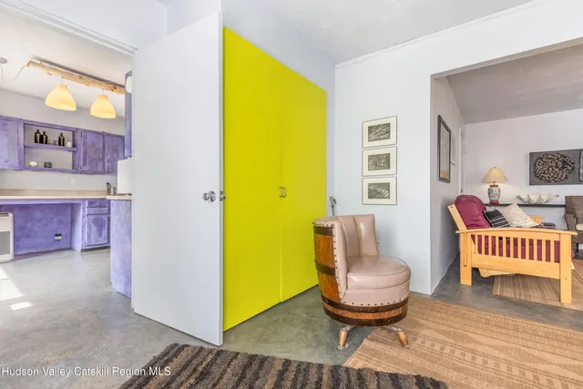 a living room with a couch and a table