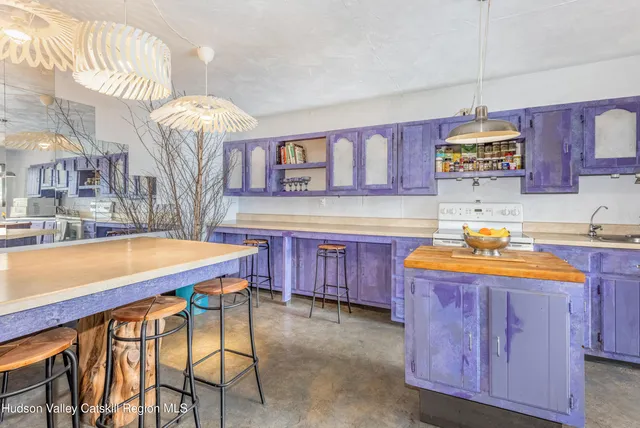 a kitchen with stainless steel appliances granite countertop a sink and a wooden cabinets