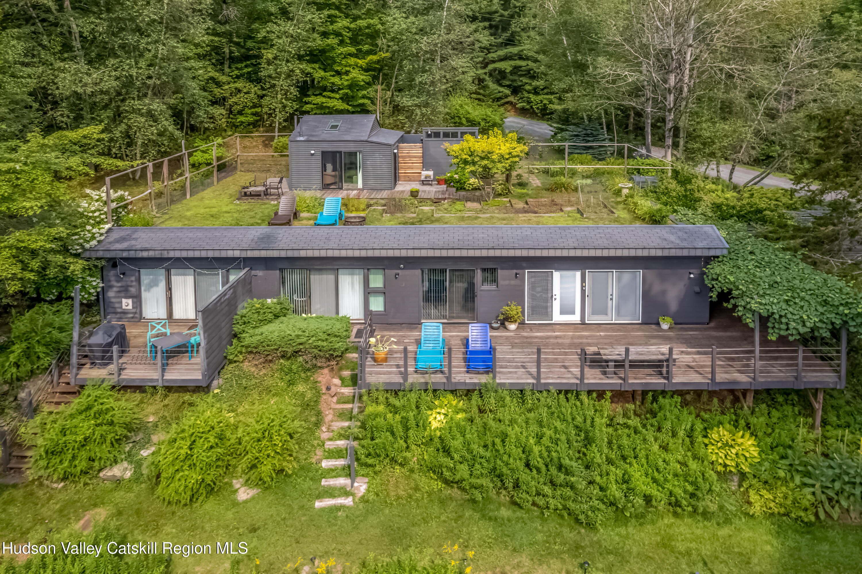 166 Todd Hill Road, Unit 166 West Kill, NY 12492 - Photo 2 of 42 a view of a house with a yard and sitting area