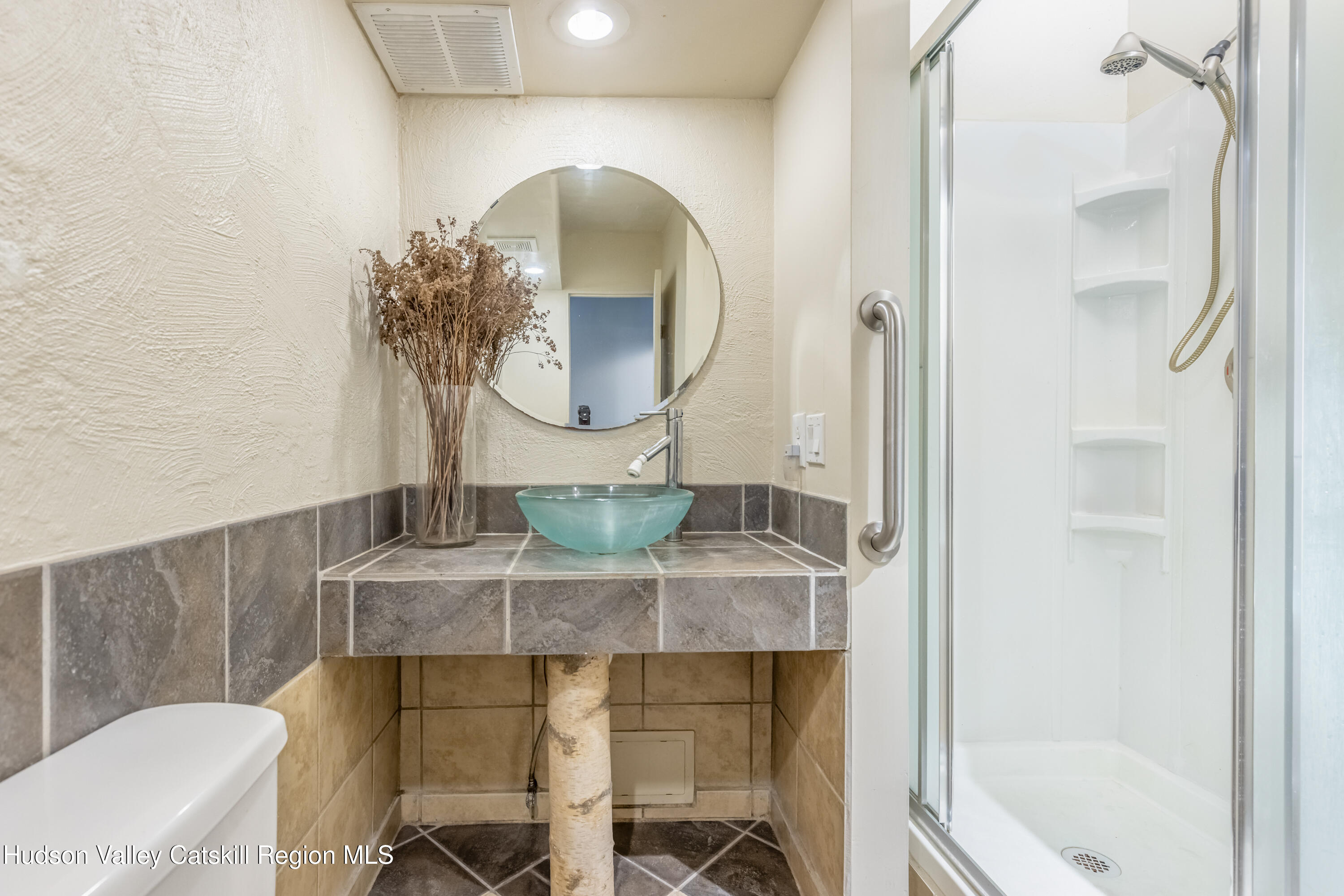166 Todd Hill Road, Unit 166 West Kill, NY 12492 - Photo 21 of 42 a bathroom with a sink and a mirror