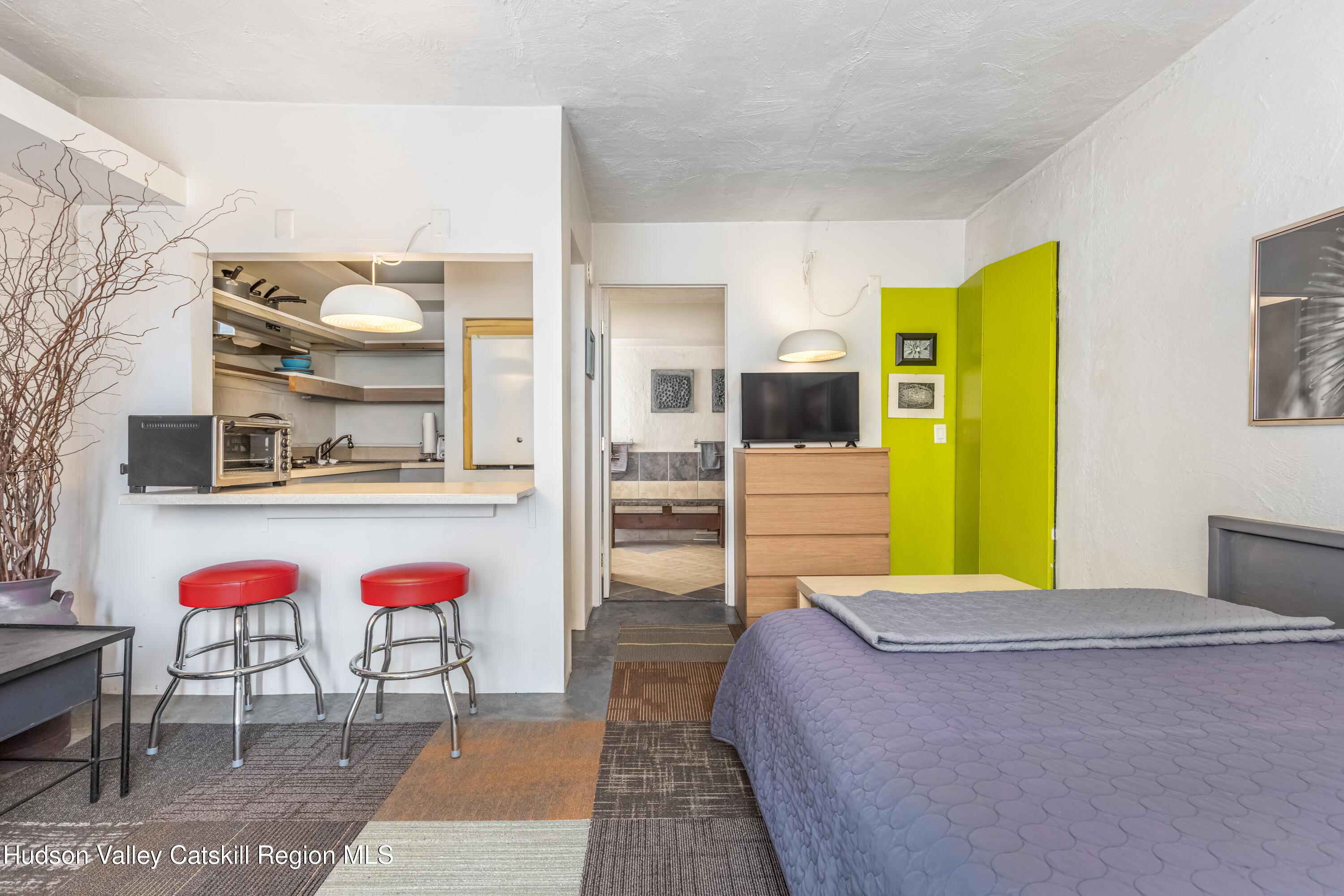 166 Todd Hill Road, Unit 166 West Kill, NY 12492 - Photo 26 of 42 a bed room with a bed and dresser