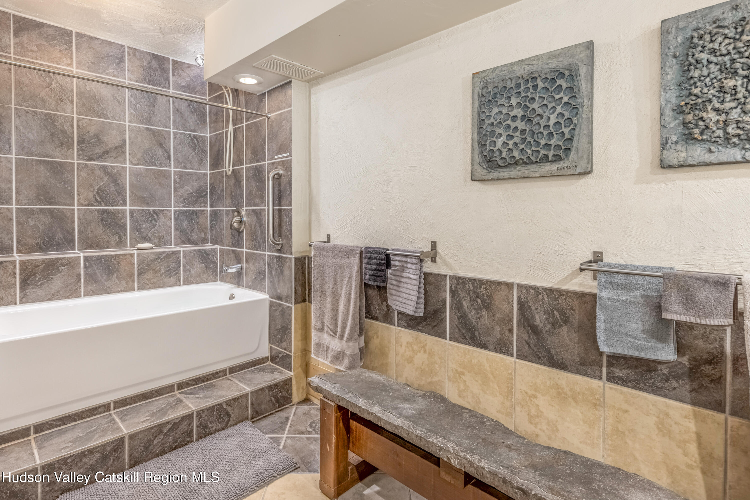 166 Todd Hill Road, Unit 166 West Kill, NY 12492 - Photo 28 of 42 a bathroom with a bathtub and a sink