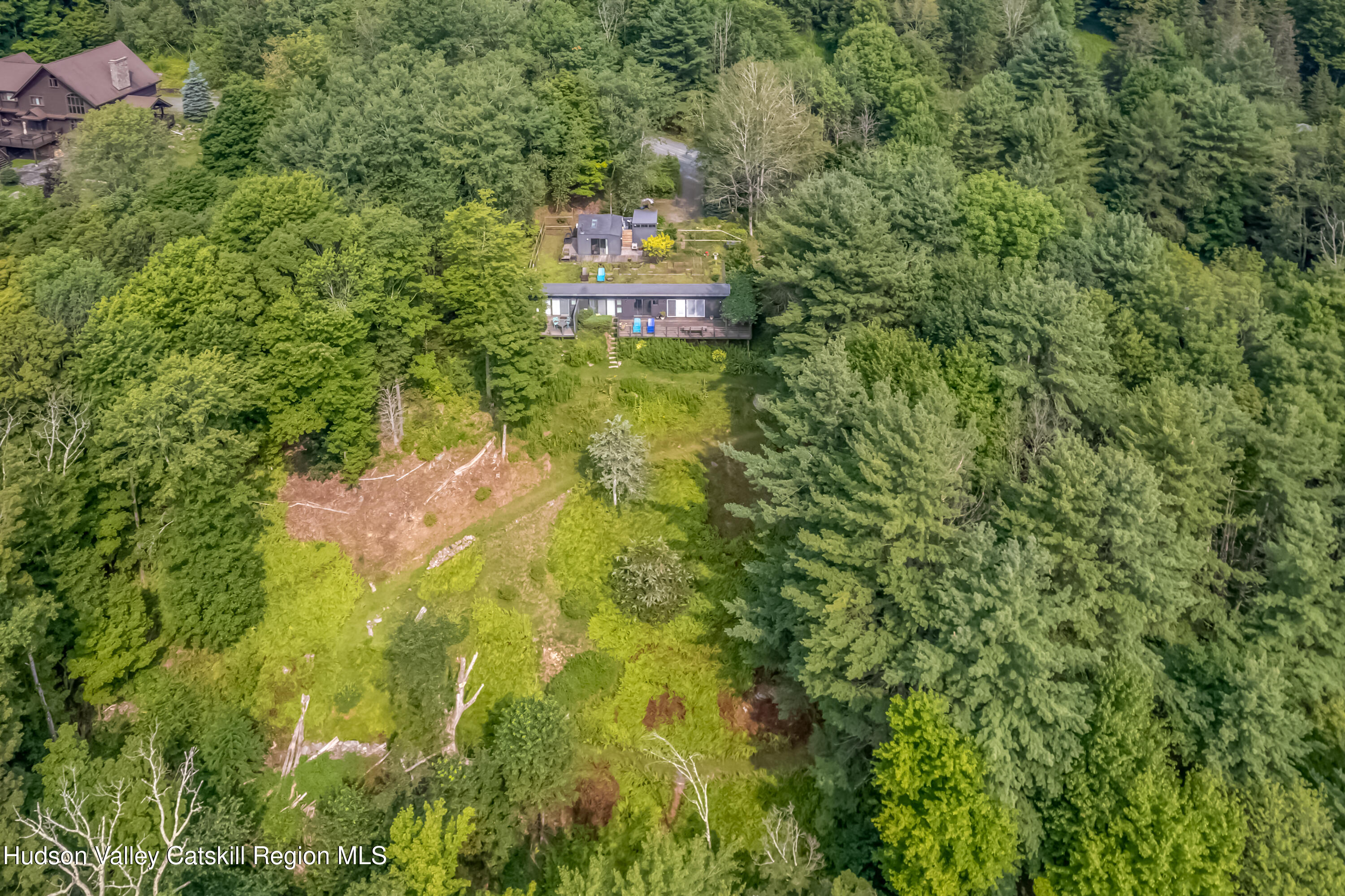 166 Todd Hill Road, Unit 166 West Kill, NY 12492 - Photo 3 of 42 a aerial view of a house with a yard and large trees