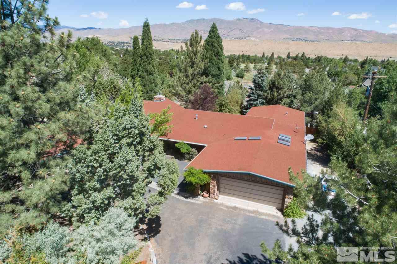 4321 Bridle Way Reno, NV 89519 - Photo 1 of 25 an aerial view of a house with a yard and lake view