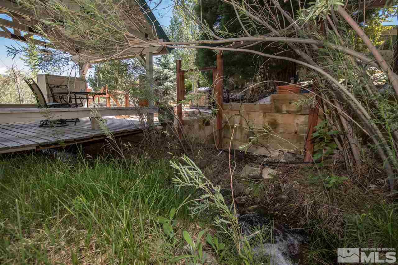 4321 Bridle Way Reno, NV 89519 - Photo 11 of 25 a backyard of a house with chairs and table