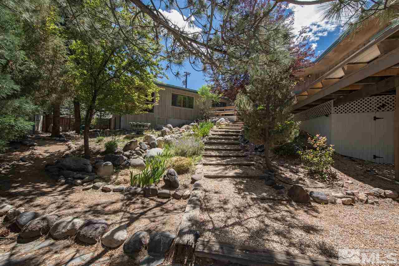 4321 Bridle Way Reno, NV 89519 - Photo 12 of 25 a front view of a house with a yard