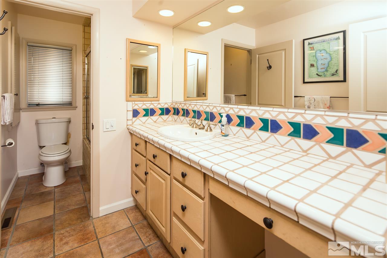 4321 Bridle Way Reno, NV 89519 - Photo 21 of 25 a bathroom with a sink and a mirror