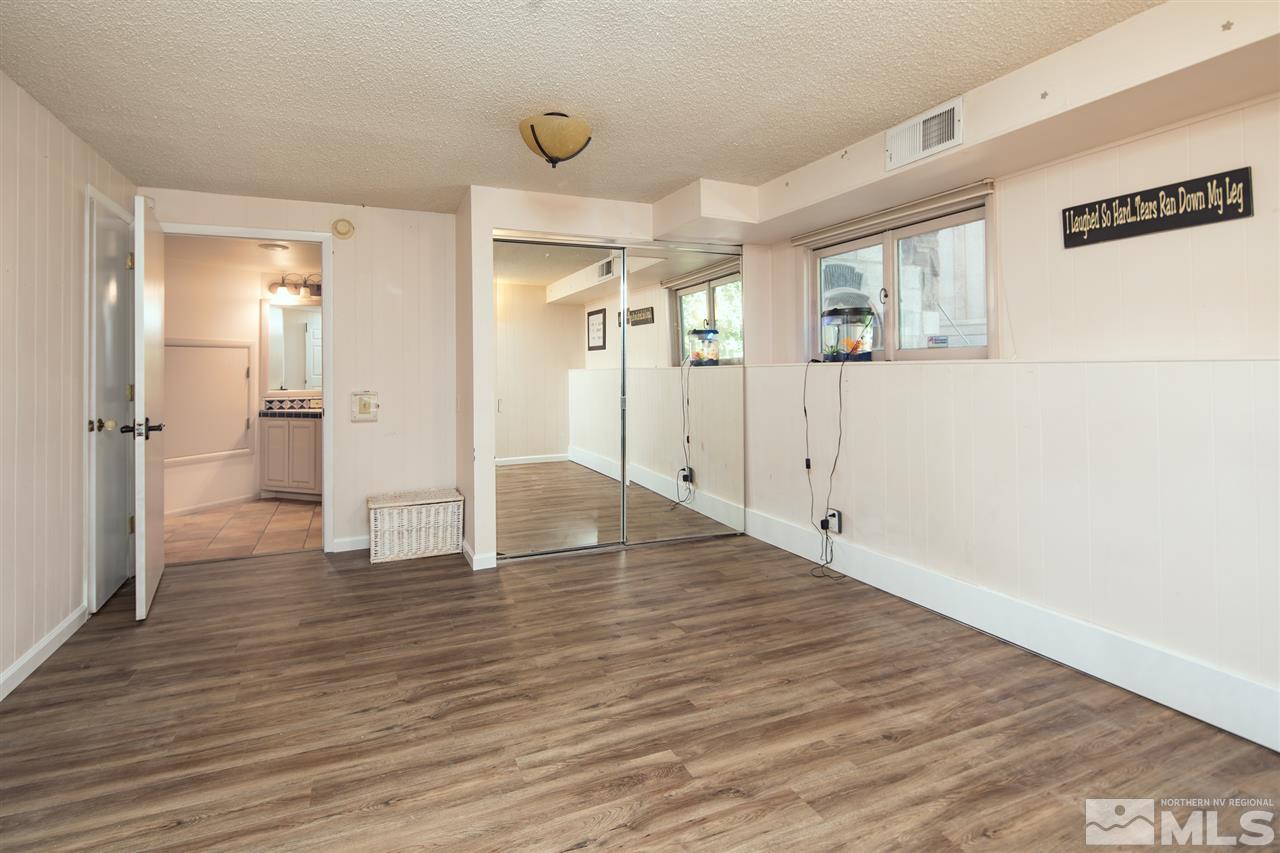 4321 Bridle Way Reno, NV 89519 - Photo 22 of 25 a view of a hallway with wooden floor