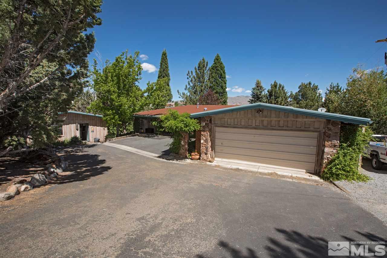 4321 Bridle Way Reno, NV 89519 - Photo 3 of 25 a view of a house with a yard and garage
