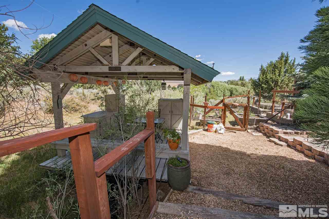 4321 Bridle Way Reno, NV 89519 - Photo 8 of 25 a view of a wooden house with a porch
